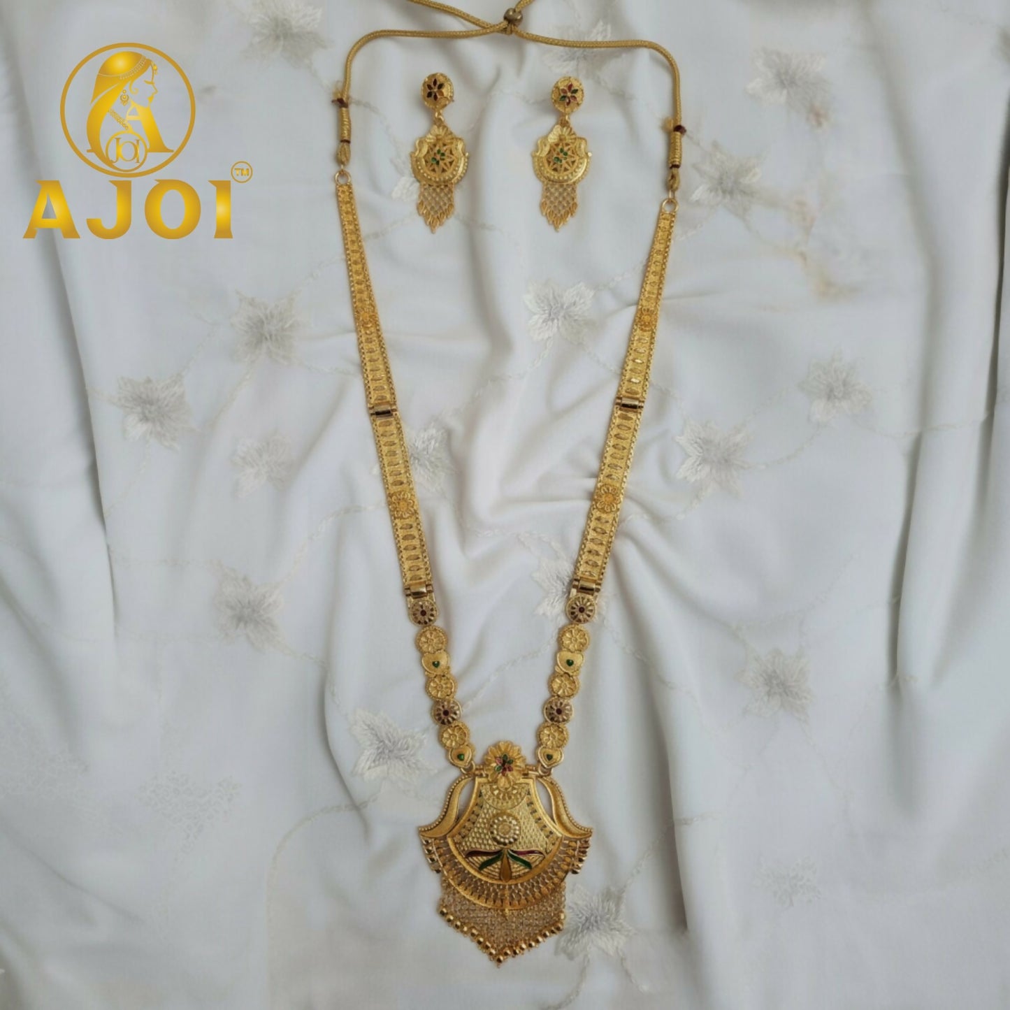 Statement earrings matching the Luxe Long Necklace Set with detailed heritage design