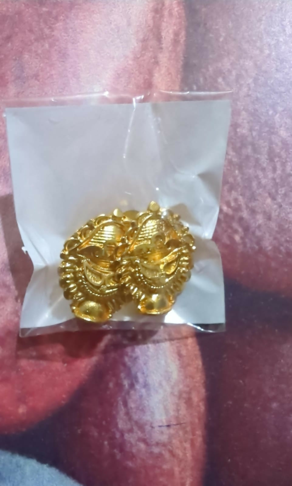 Elegant traditional golden earrings with bell-shaped drops and enamel highlights