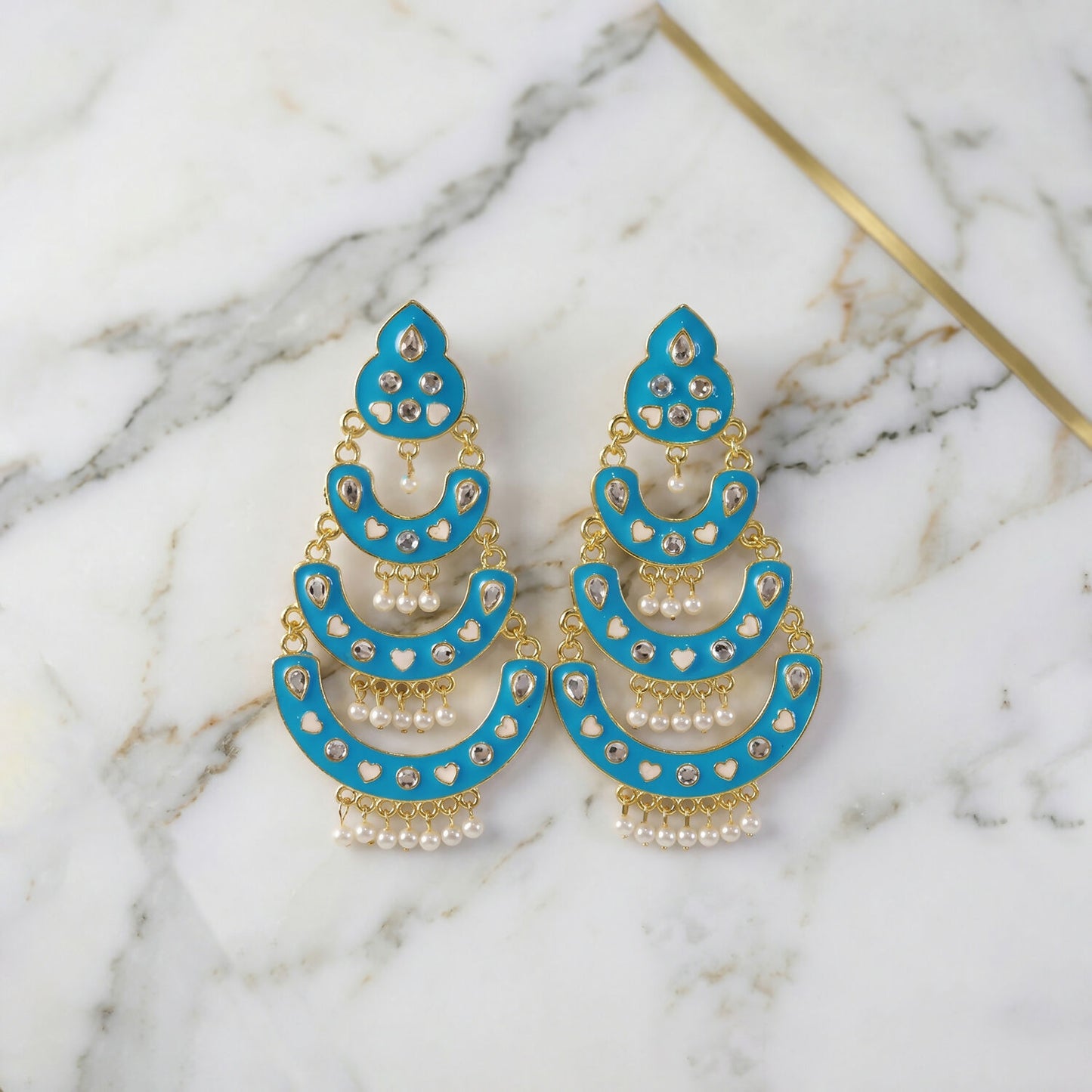 Full view of sky blue layered chandbali earrings with pearls