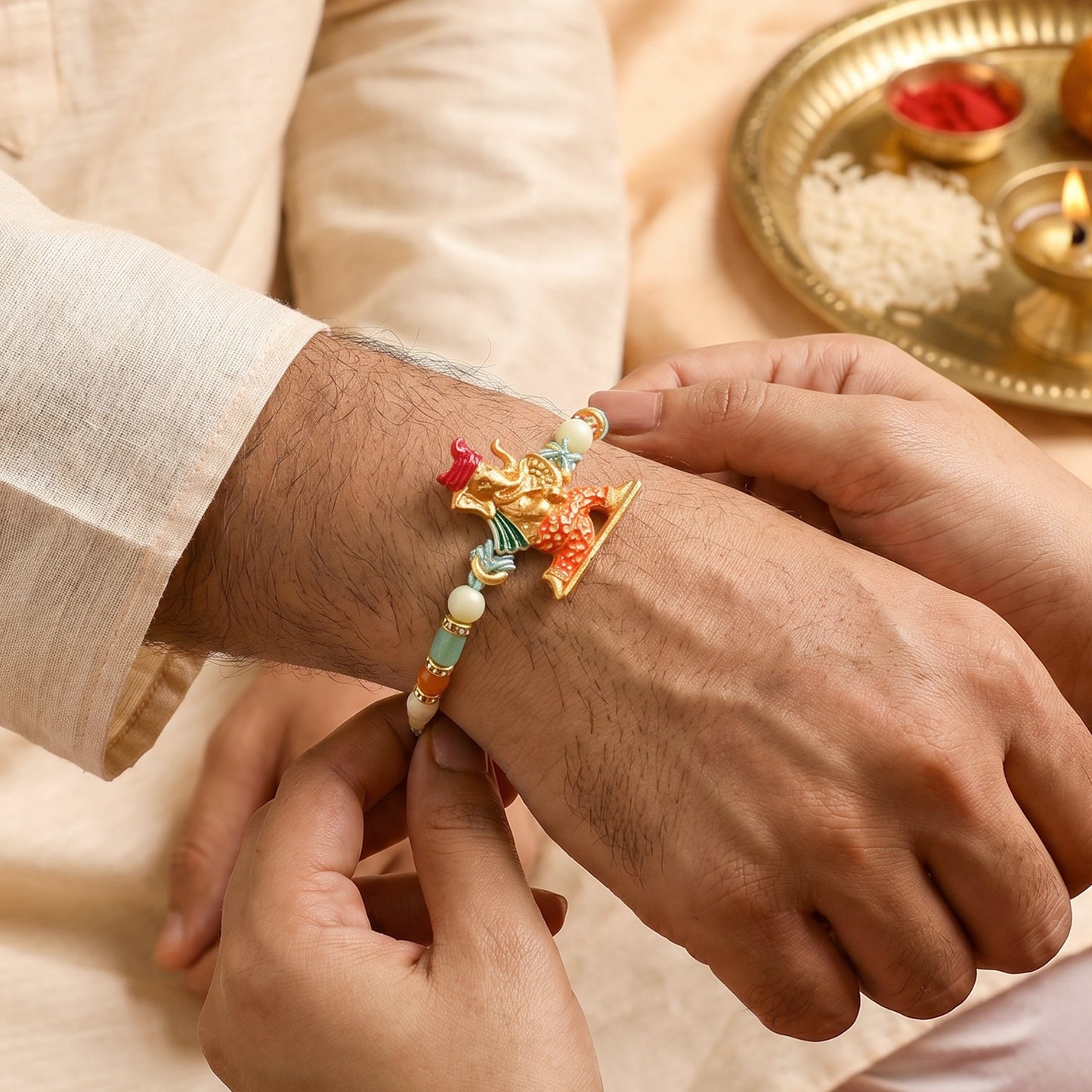 Colorful Ganesh Rakhi for Boys with Beads and Red-Blue Thread