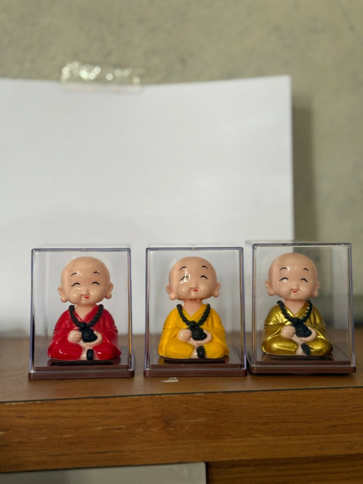 Solar Monk Bobble Head with Moving Head in Clear Display Case (Color may vary)