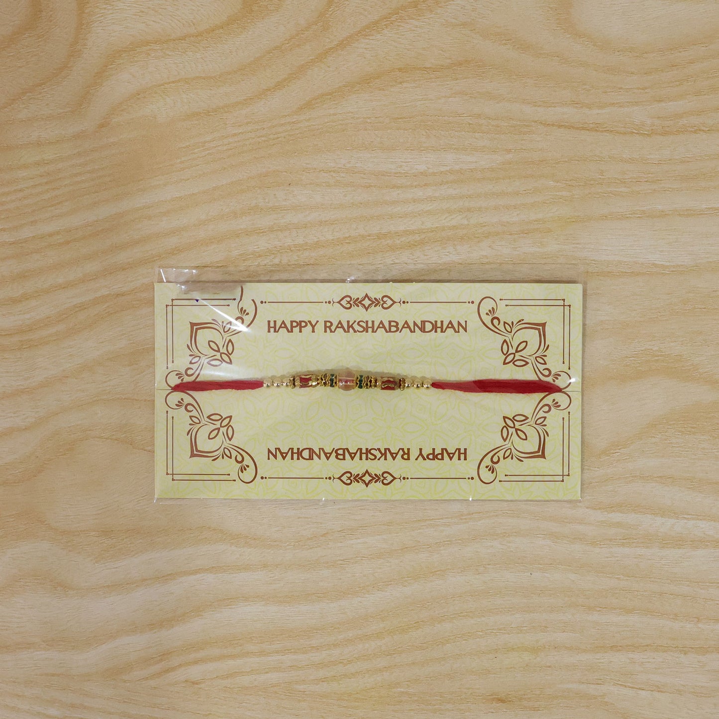 Red Green Stone Golden Designer Rakhi with Traditional Beads and Festive Thread