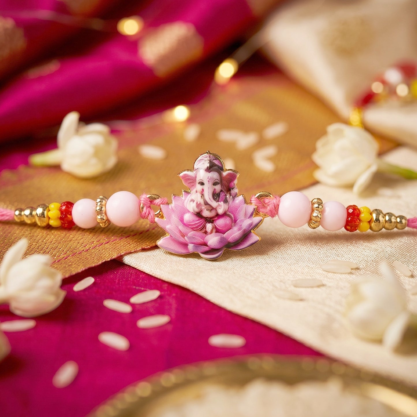 Lord Ganesha on Pink Lotus Designer Rakhi