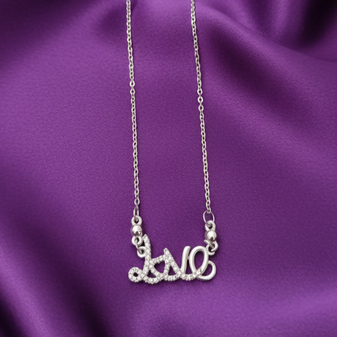 Silver plated Love Script pendant necklace with shimmering pavé crystals