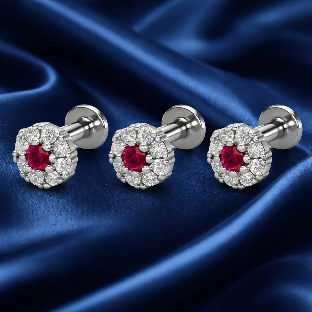 Close-up of a silver plated ruby flower stud earring with flat back labret post for secure fit