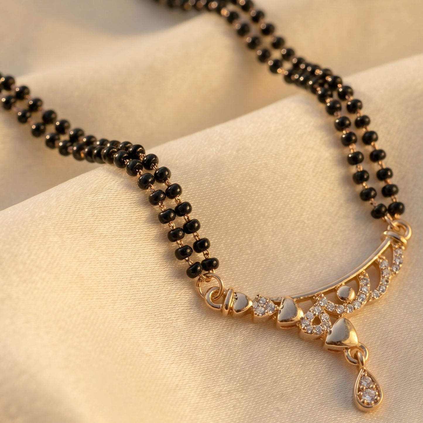 Rose Gold Finish Triple Strand Heart Charms & CZ Bar Mangalsutra with Teardrop Drop