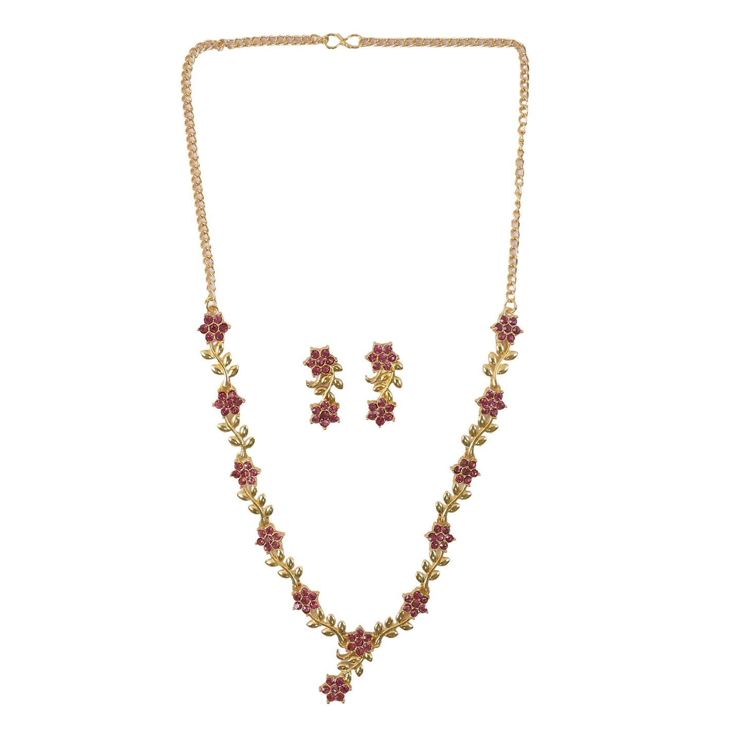 Jewelry set with gold floral design and ruby accents displayed on fabric