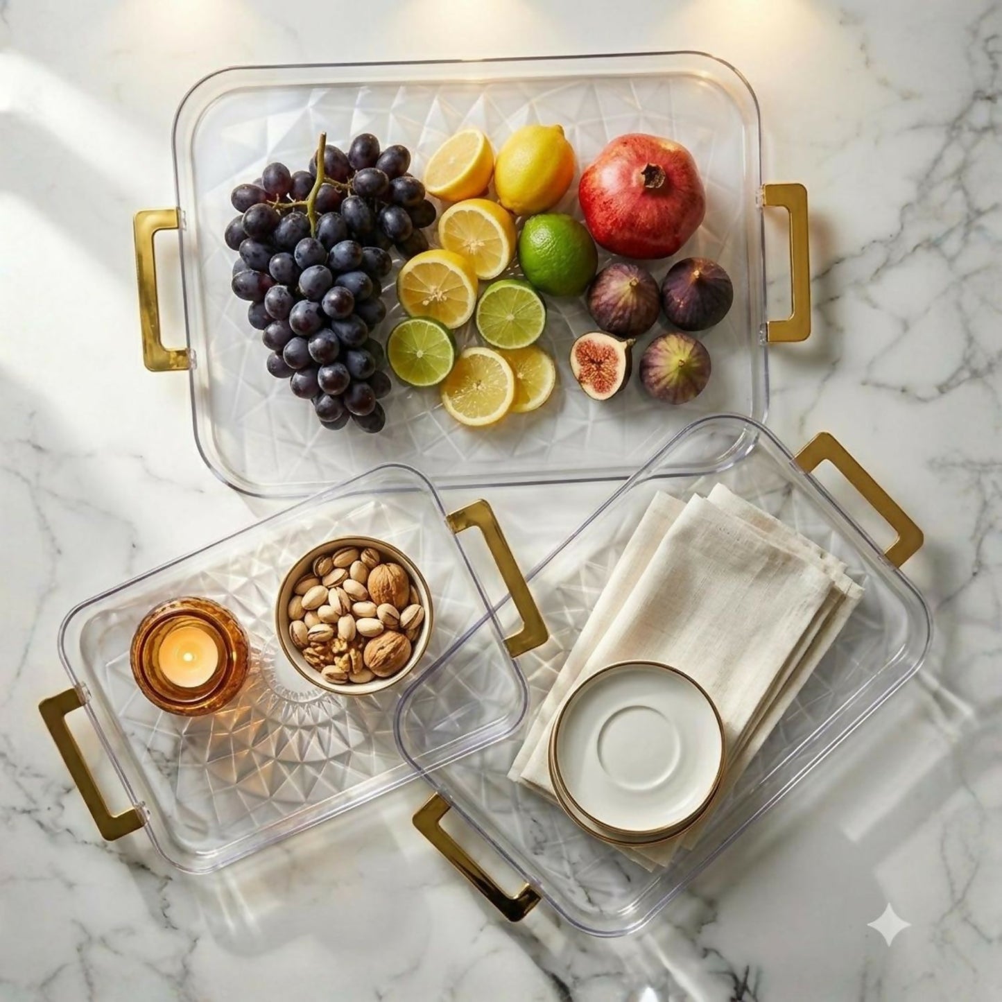 Stacked transparent multipurpose serving trays with golden handles