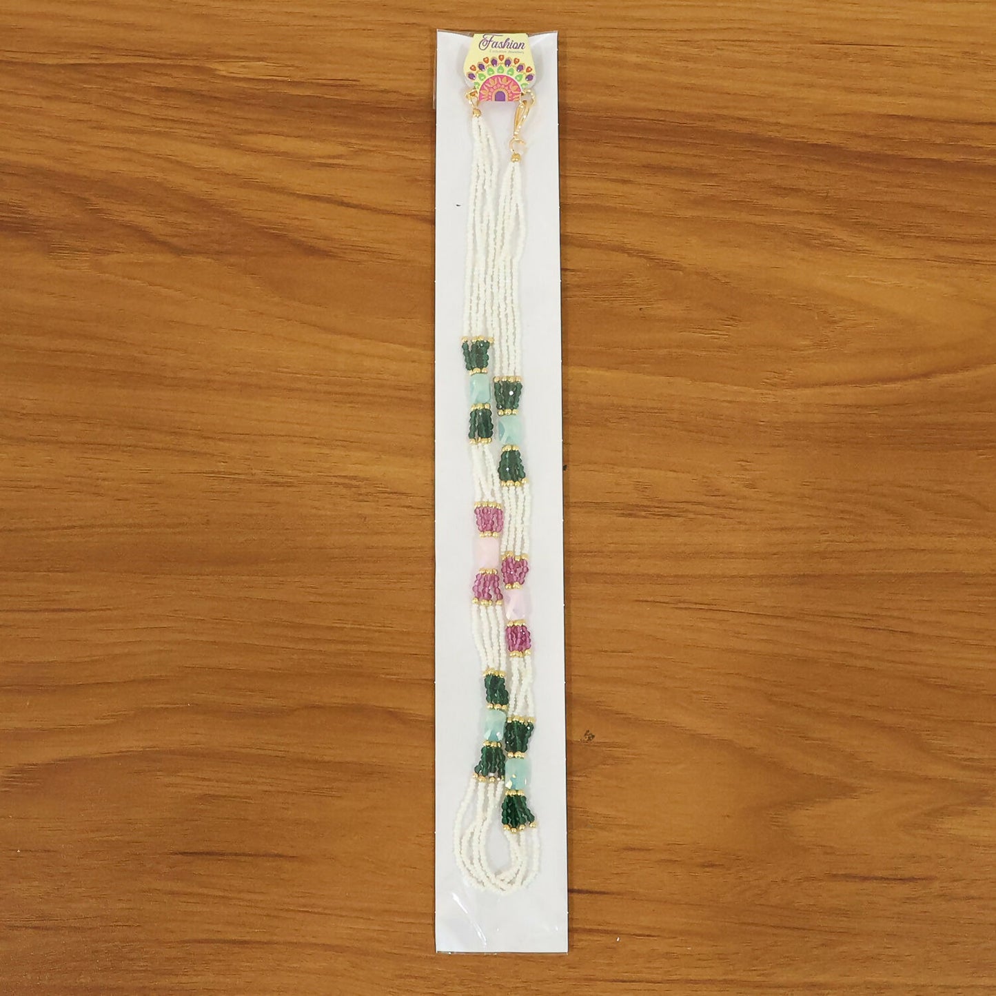 Multicolor handmade mala necklace displayed on stand