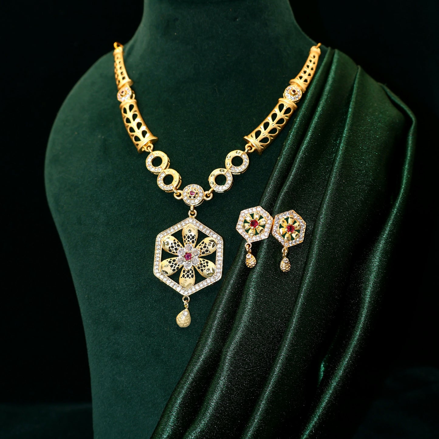 Full view of the gold plated hexagon pendant necklace set displayed elegantly.