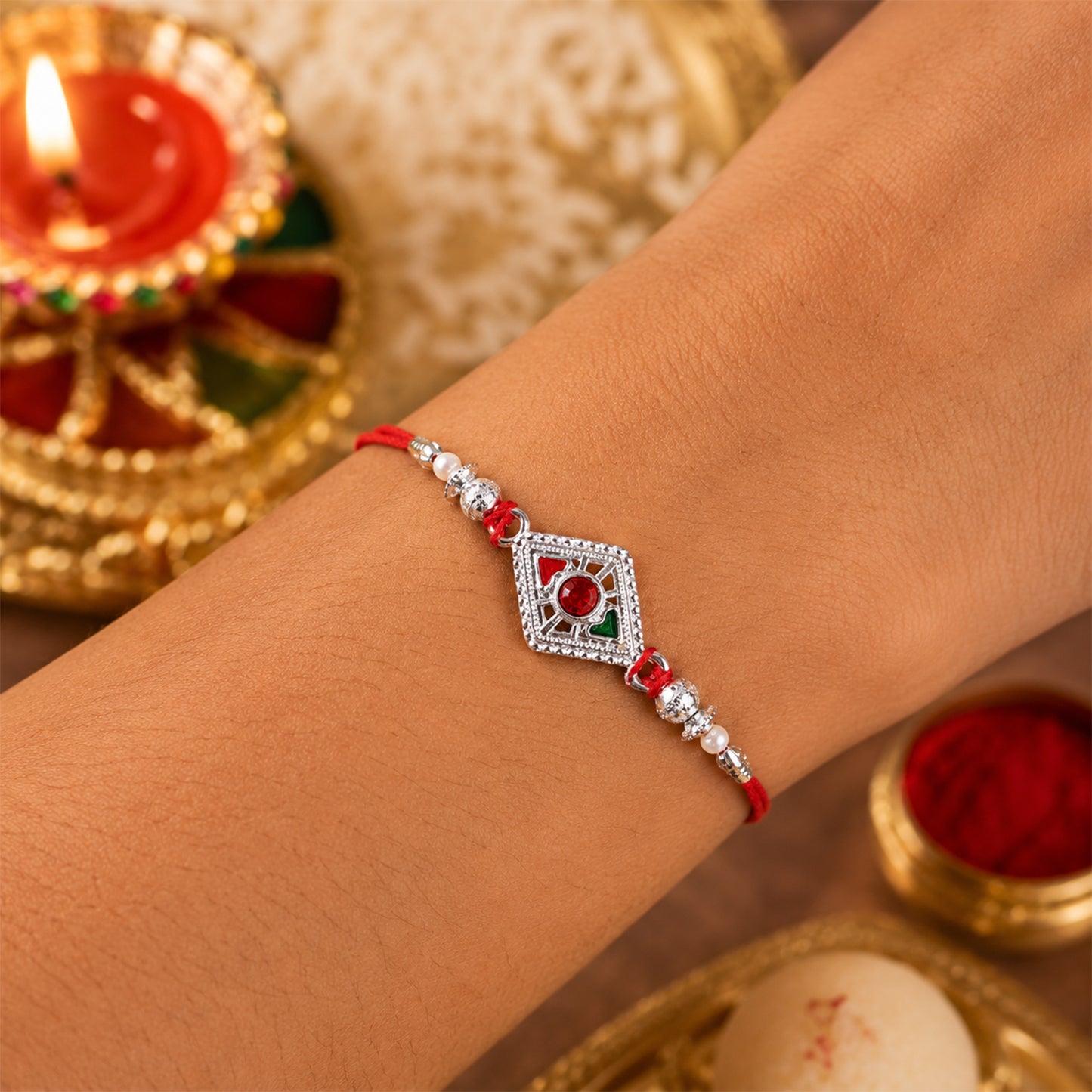 Square Silver Rakhi with Red Stone Center and Pearl Bead Chain