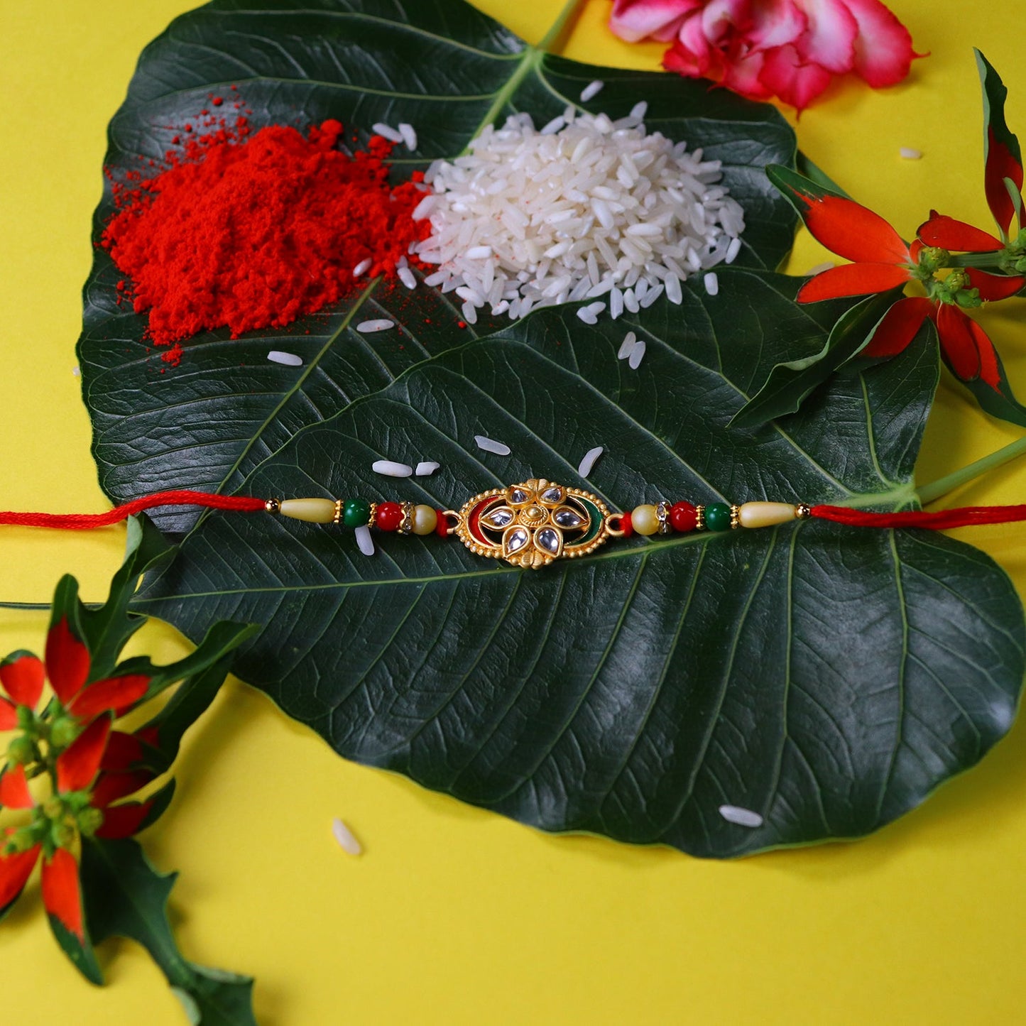 Flower Design Rakhi with Red and Green Beads Festive Elegance (10pcs)