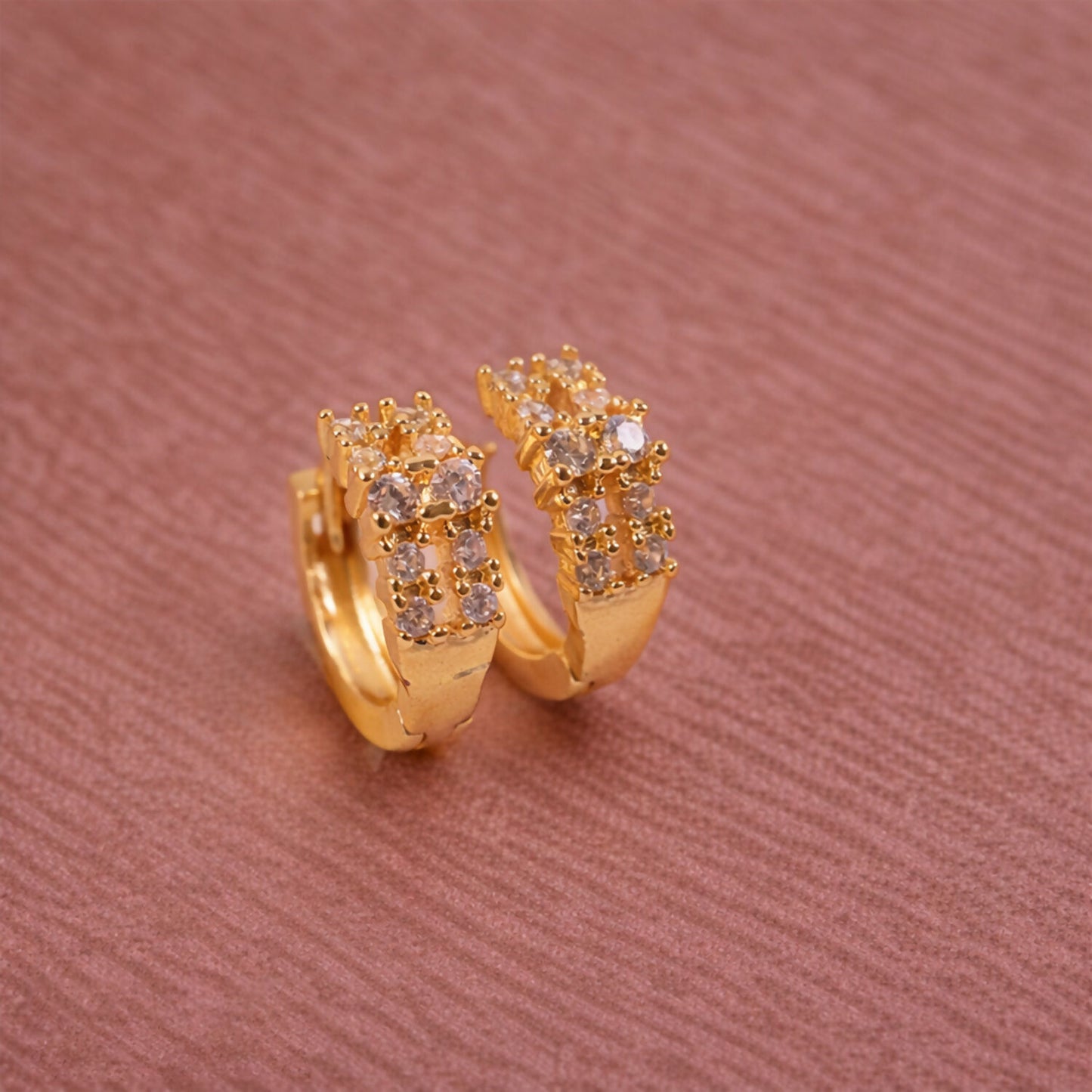 Elegant hoop earrings with gold-tone and crystal embellishments