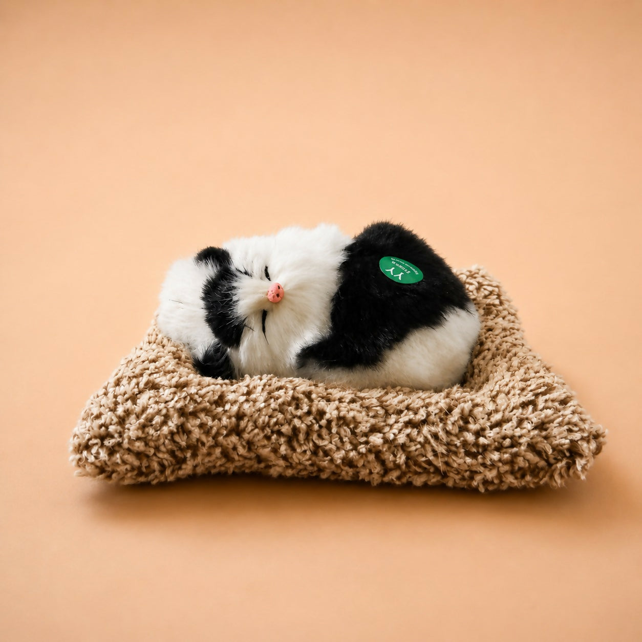 Side angle of sleeping cat plush toy dashboard decor