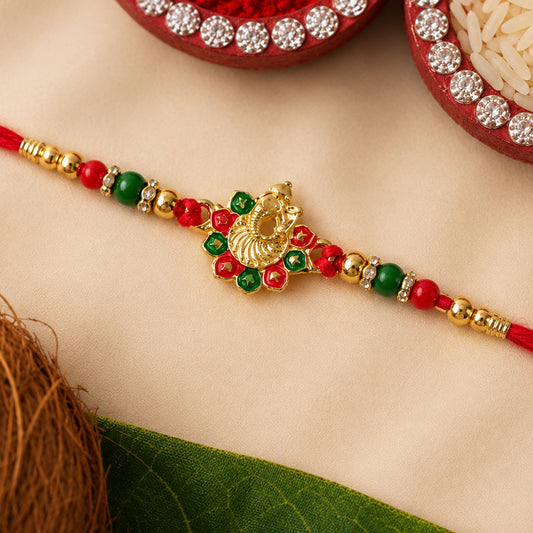 Elegant Ganesha Rakhi featuring intricate beads and stone work for Raksha Bandhan