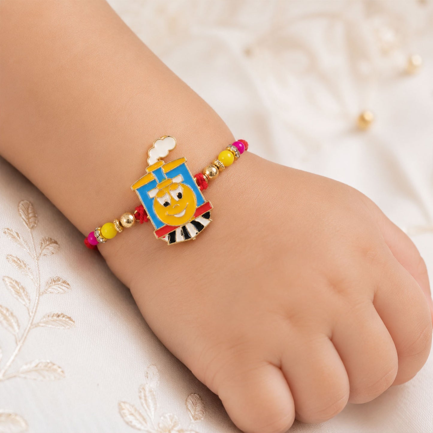 Train Cartoon Kids Rakhi – Colorful Beads & Red Thread Festive Gift