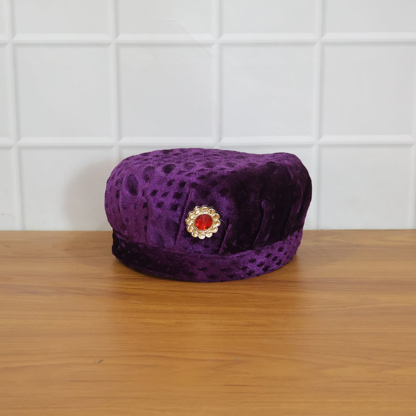 Velvet boys cap shown in live festive setting