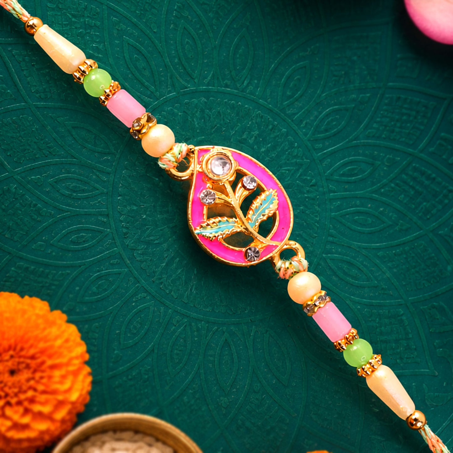 Leaf Shaped Pink and Green Enamel Pendant Rakhi with Pastel Beads
