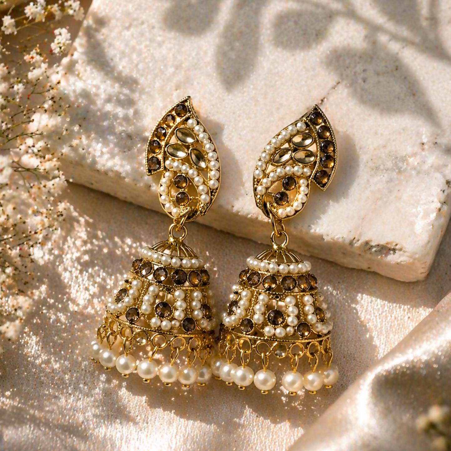 Gold plated pearl and stone studded traditional jhumka earrings