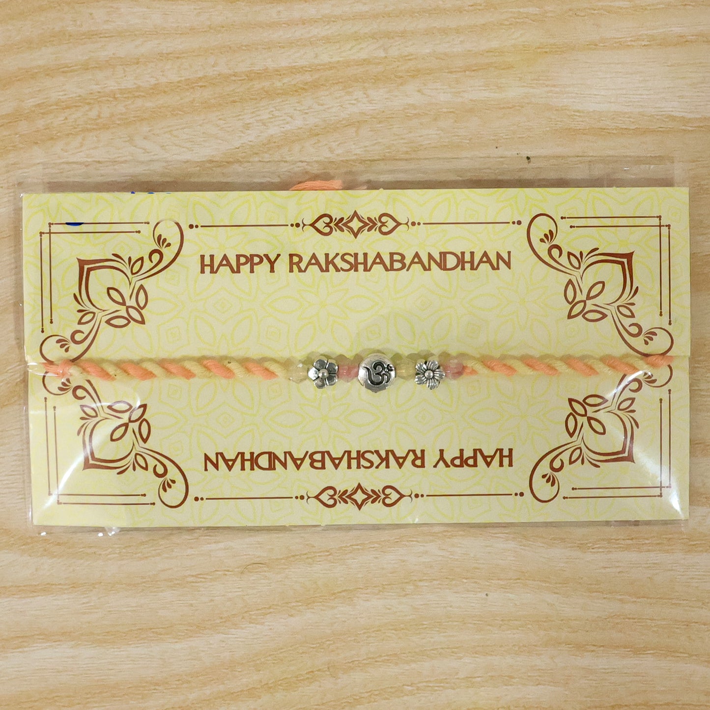 Graceful Pastel Bracelet Rakhi with Silver Centre and Delicate Raksha Bandhan Beauty