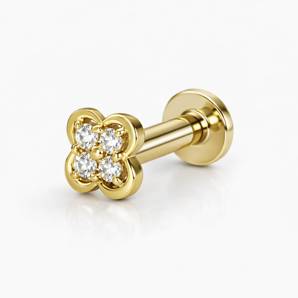 Close-up of gold plated clover stud earring with brilliant-cut diamonds