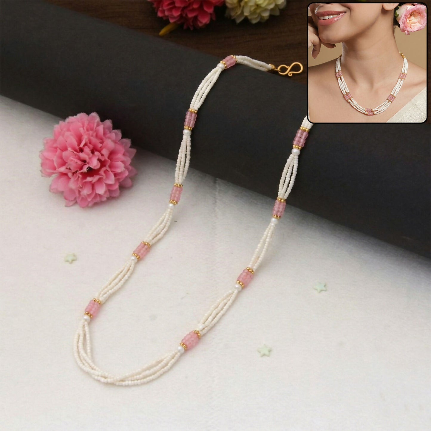 Elegant multi-layer pearl mala necklace with pink segment accents for festive occasions