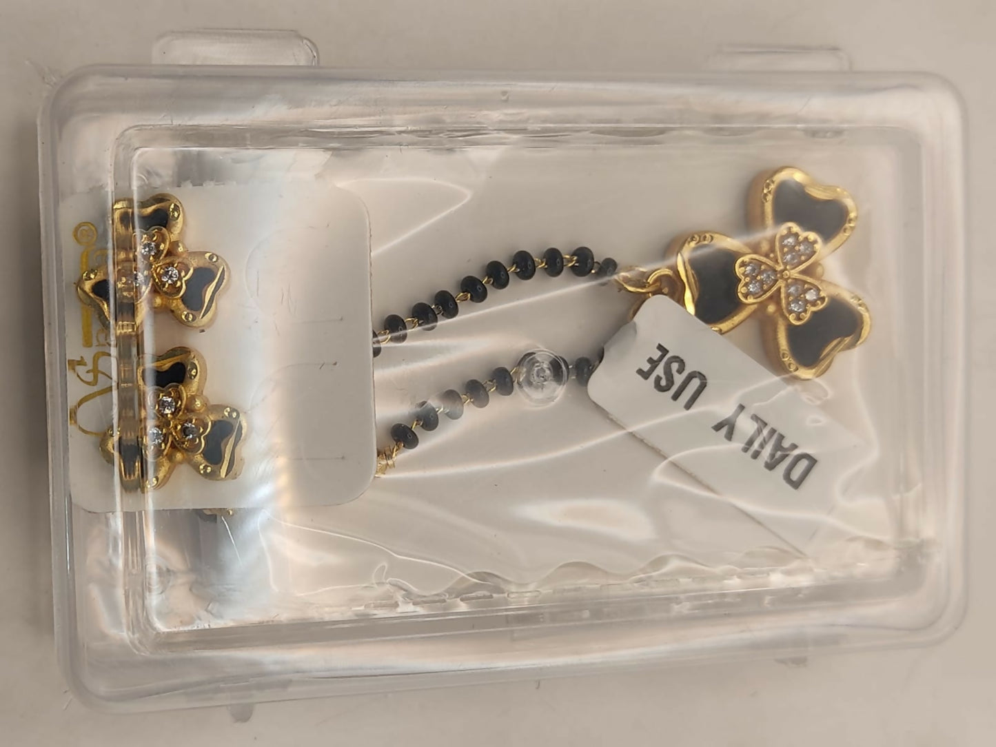 Gold-Plated AD Floral Mangalsutra Set with Clover Stud Earrings for women