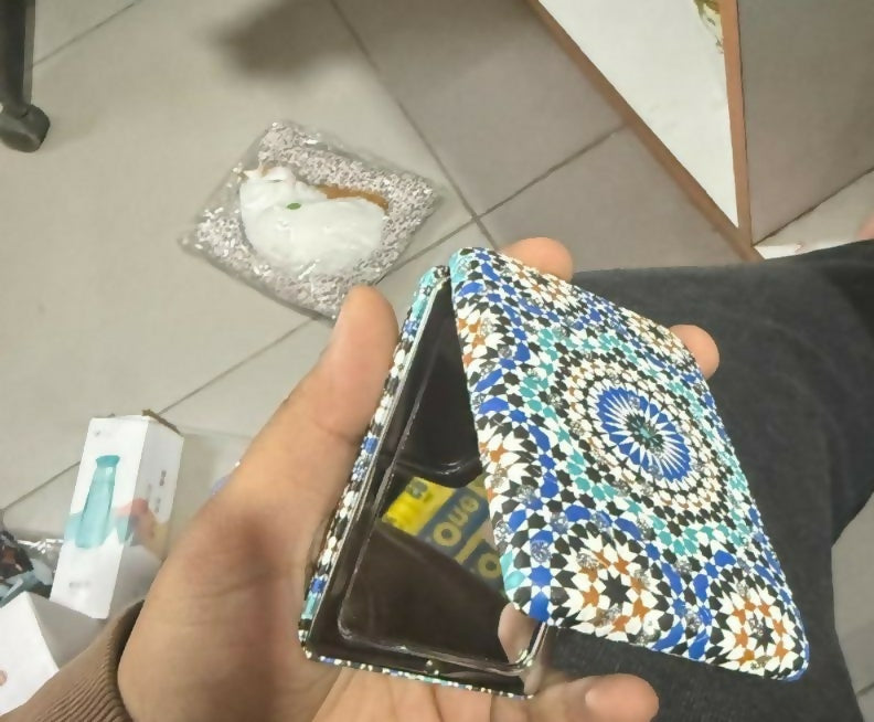 Compact foldable pocket mirror folded and portable