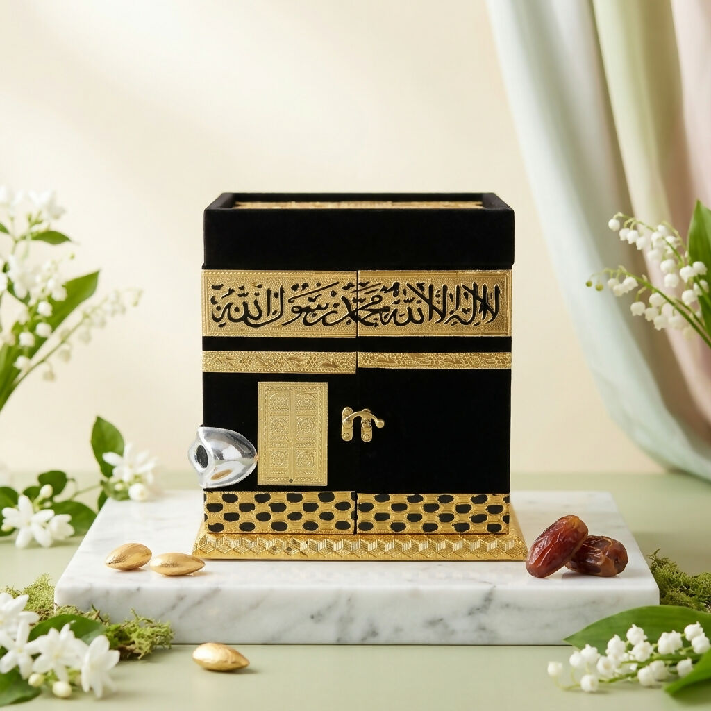 Close-up of gold-plated Arabic calligraphy on velvet Kaaba replica