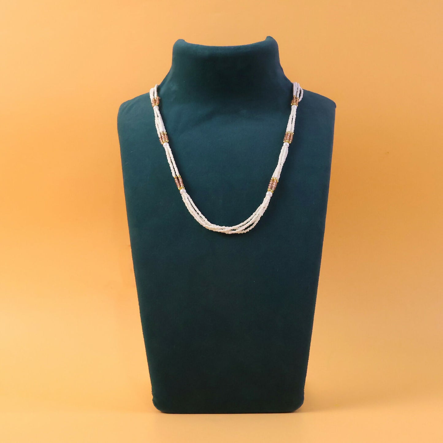 Pearl and peach mala necklace styled with traditional attire