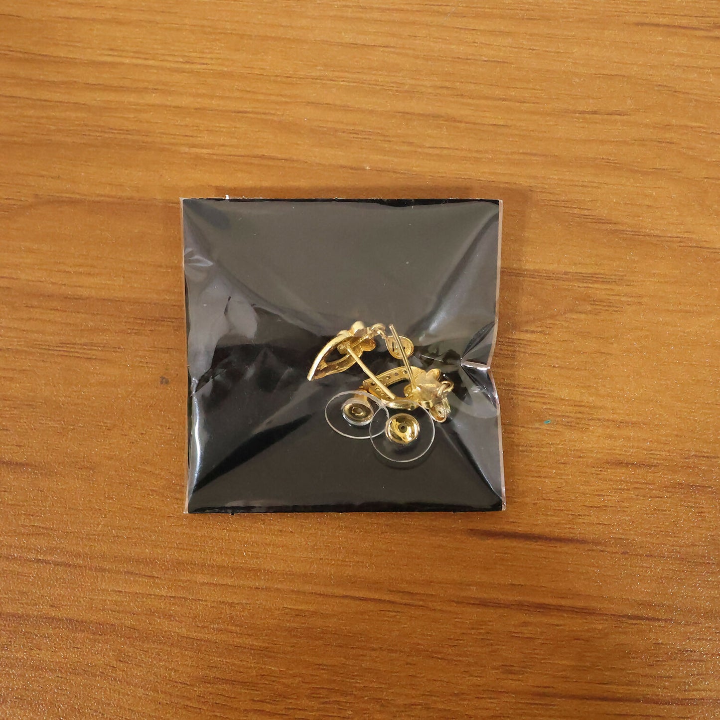 Modern Floral Gold Finish Stud Earrings With Polished Texture And Drop Accent