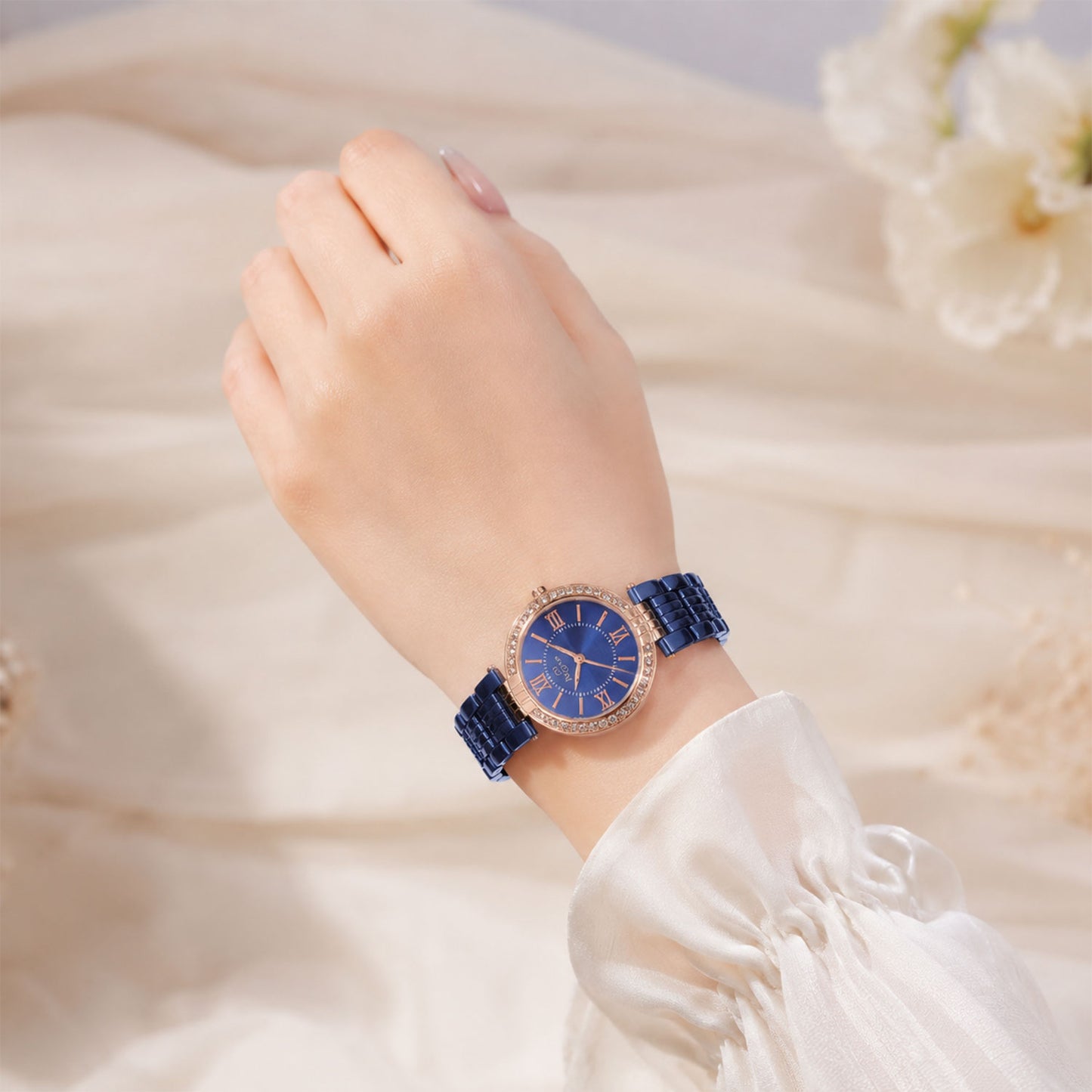 Side profile of the women's blue analog watch, highlighting the sturdy metal strap.