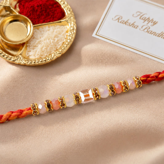 Silver Tone Designer Rakhi with pastel beads details