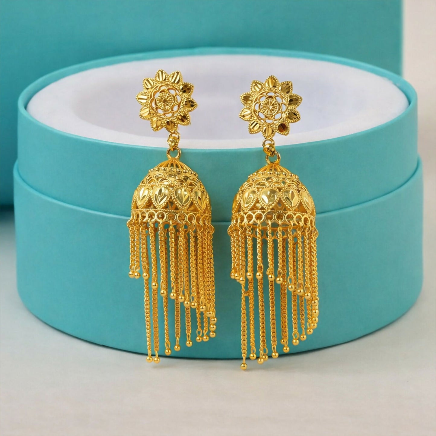 Traditional Gold Tone Floral Jhumka Earrings with Long Chain Tassel Design