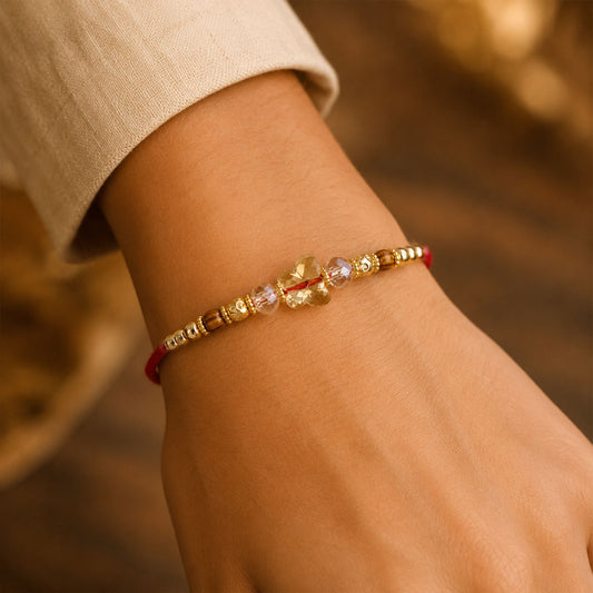 Close-up view of a Crystal Flower Cluster Rakhi with faceted stones and golden accents.