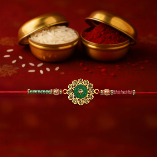 Floral Rakhi with green centerpiece and multicolor beads