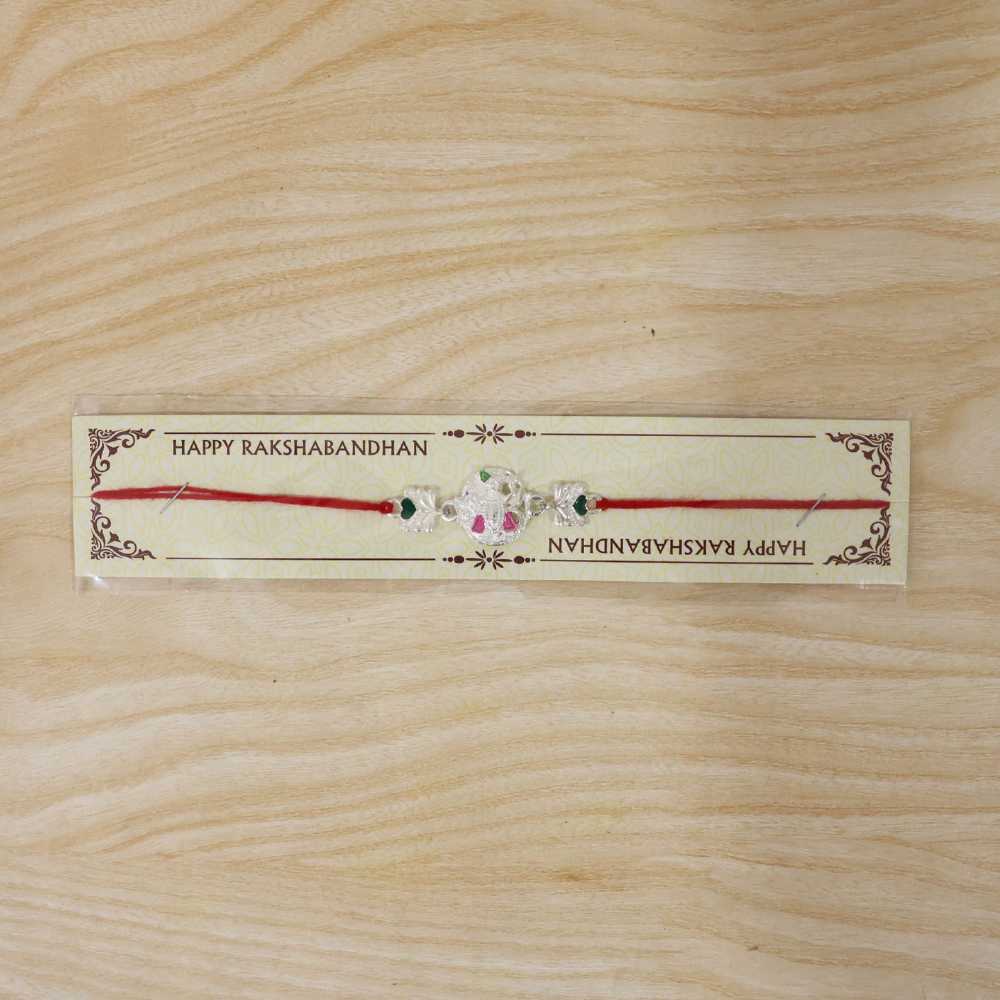 Silver Shrinathji Rakhi with Pink Green Stones and Elephant Charms