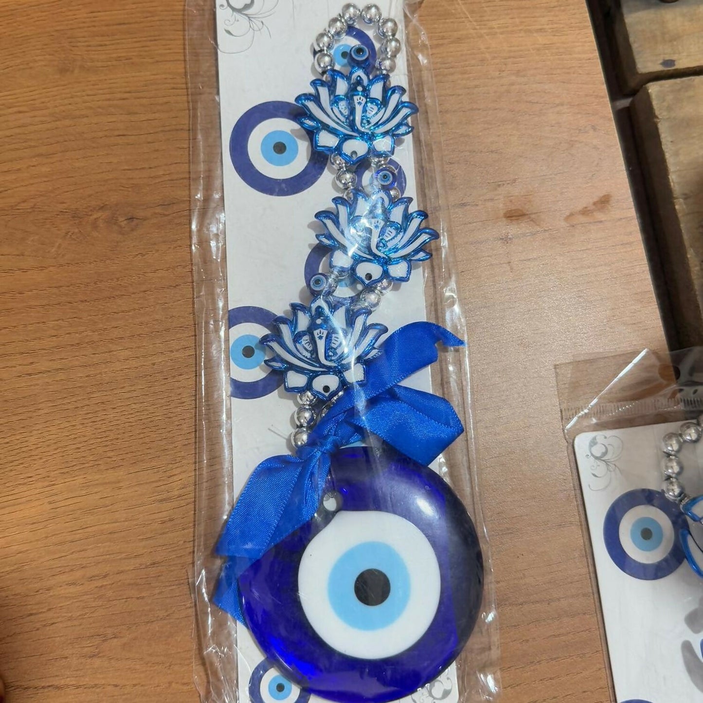Evil Eye Lotus Wall Hanging with Blue Ribbon | Protective Nazar Battu for Home & Office | Blue Glass Beads & Metal Chain Wall Décor | Traditional Spiritual Feng Shui Vastu Gift