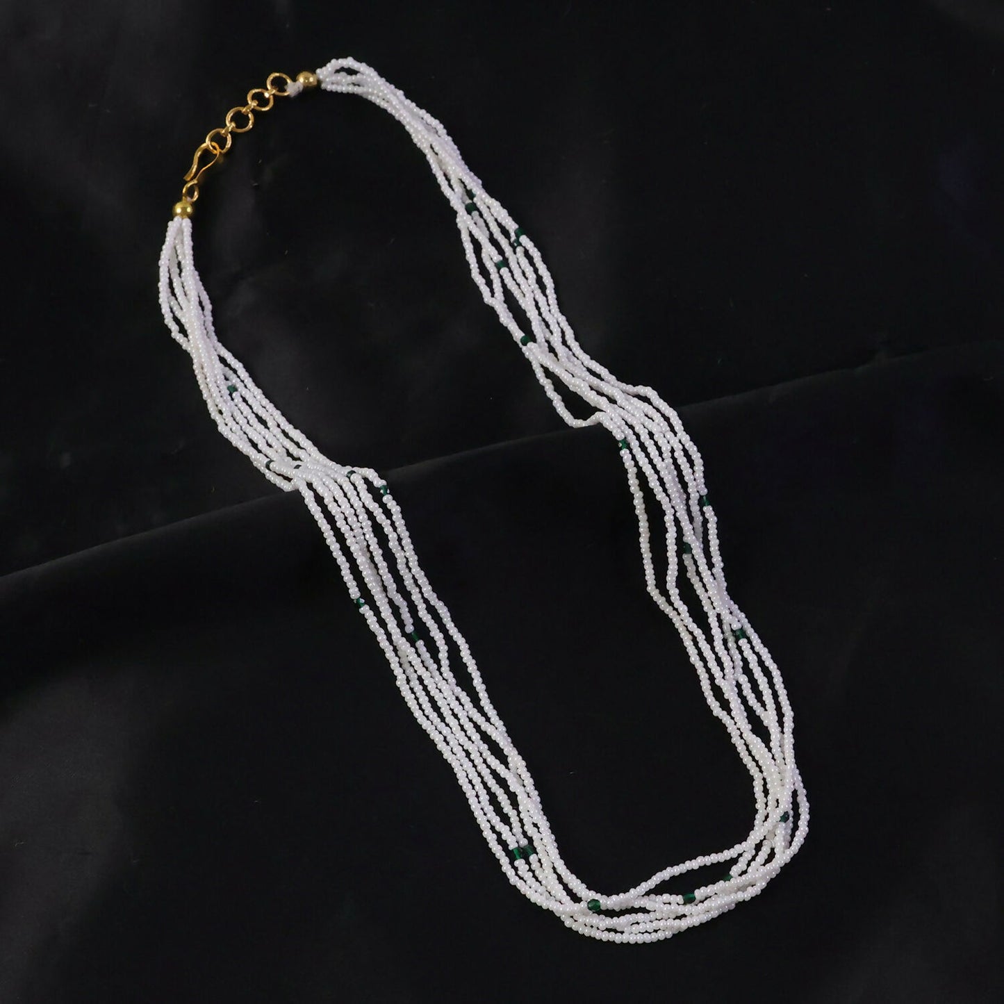 Traditional beaded pearl necklace with detailed craftsmanship