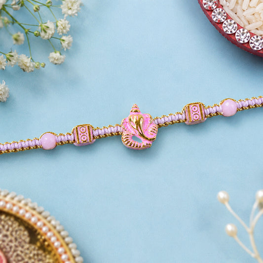 Close-up of pink bracelet designer rakhi with pearl style beads