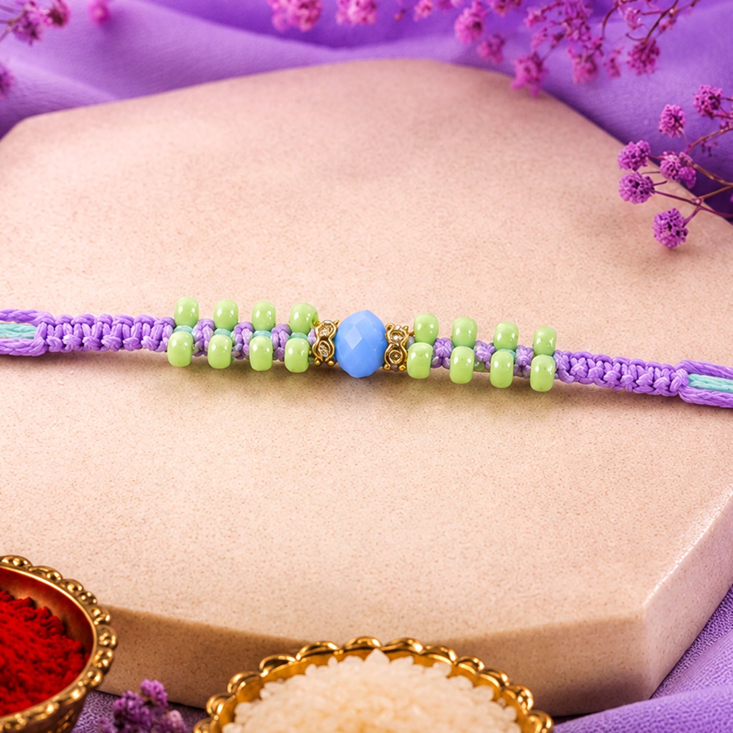 Purple Macrame Bracelet Rakhi with Green Beads, Blue Accent and Playful Thread