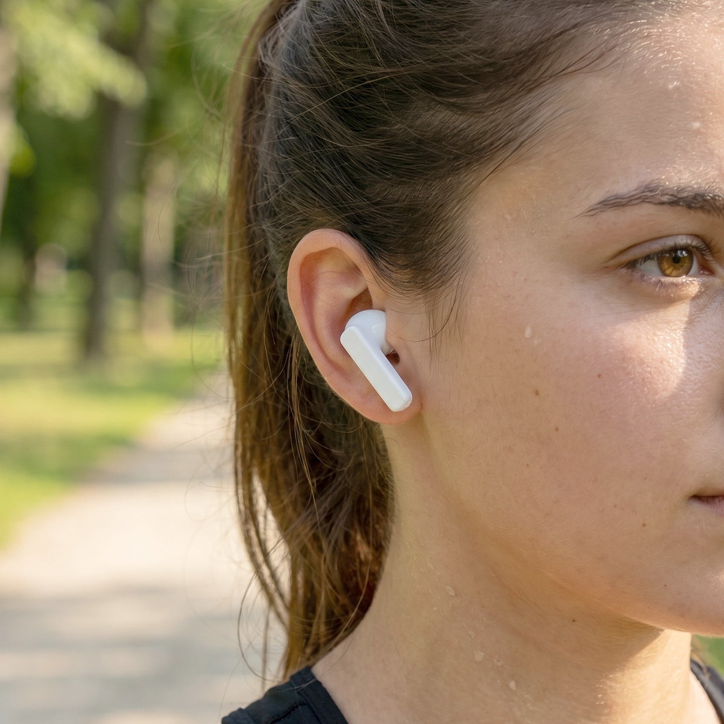 TWS wireless earbuds product image with charging cable