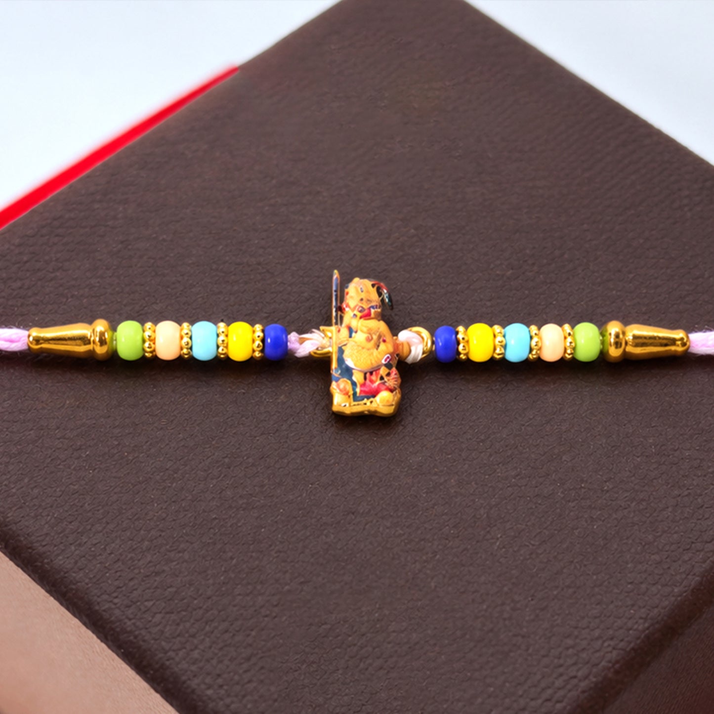 Hanuman Ji Designer Rakhi with colorful beads close-up