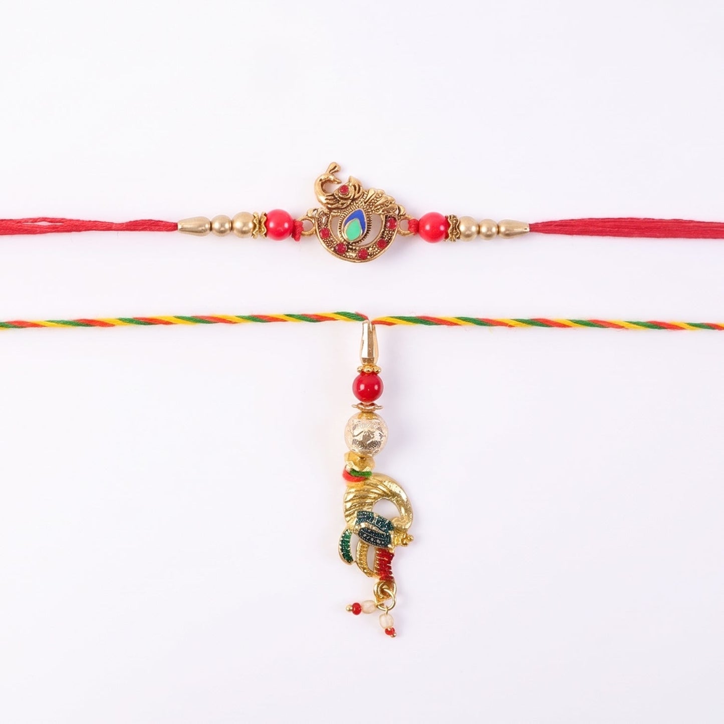 Hand holding Peacock Latkan Bhabhi Rakhi with pearl beads