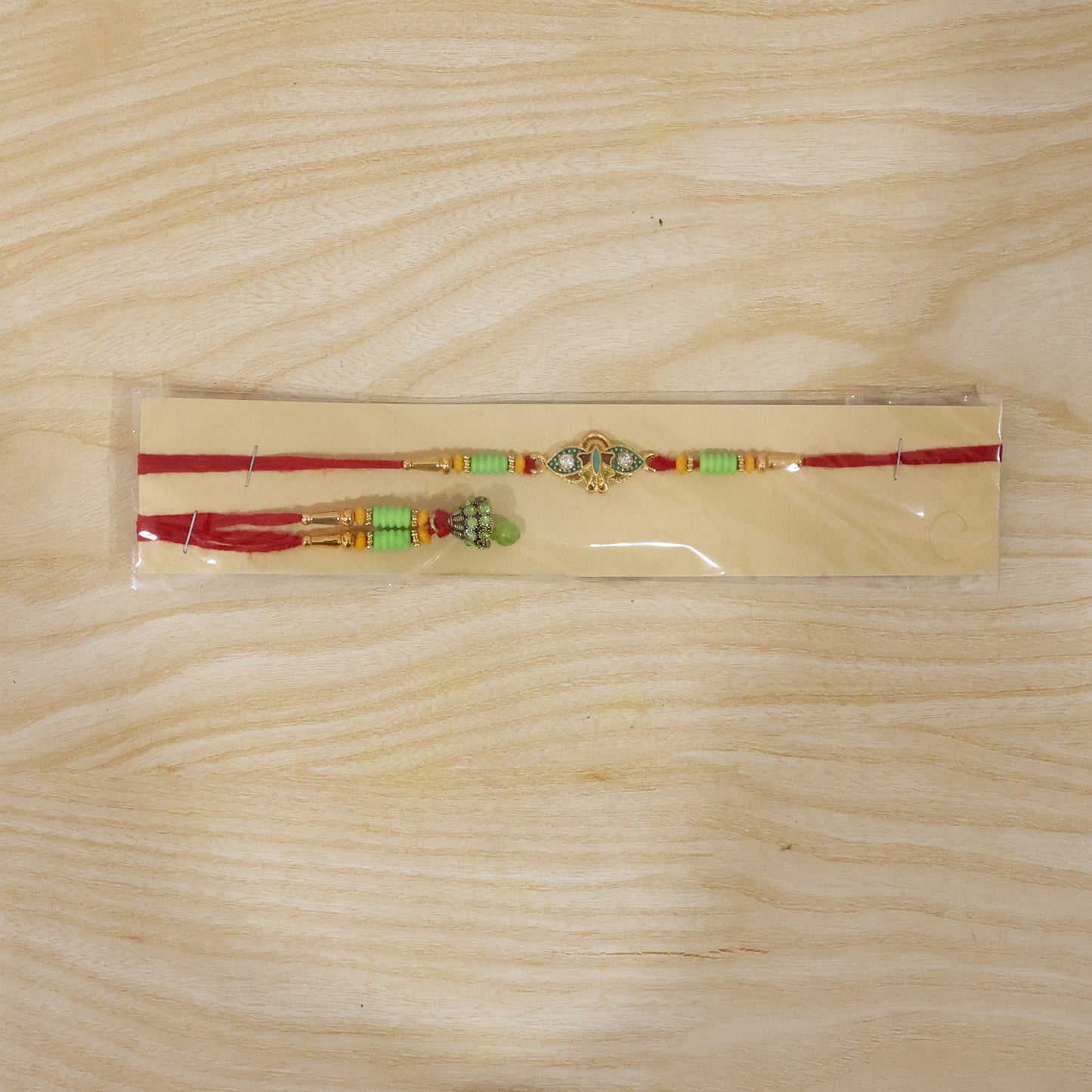 Om Peacock Bhabhi Rakhi displayed on white background