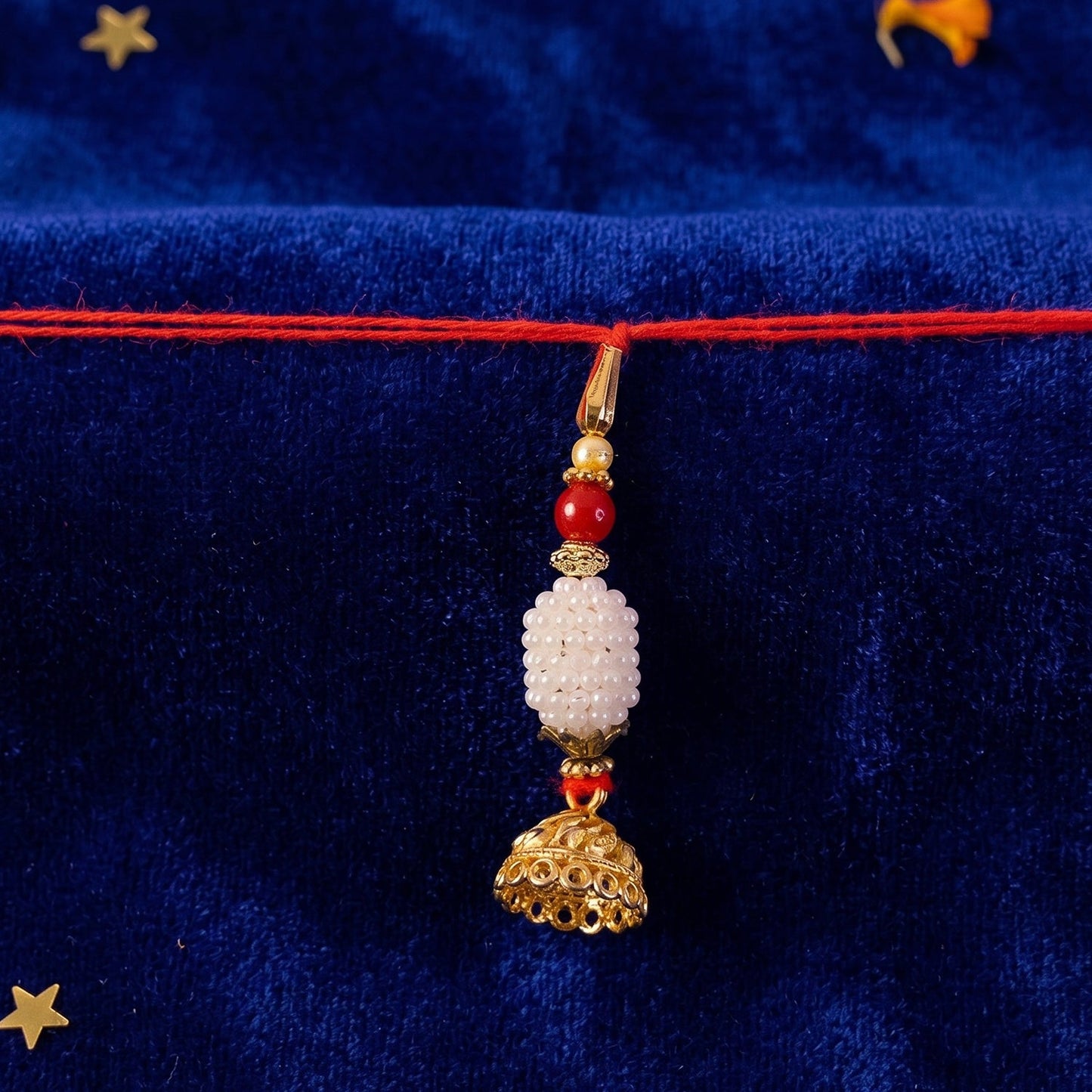 Close-up of Pearl Peacock Bhabhi Rakhi showing intricate design