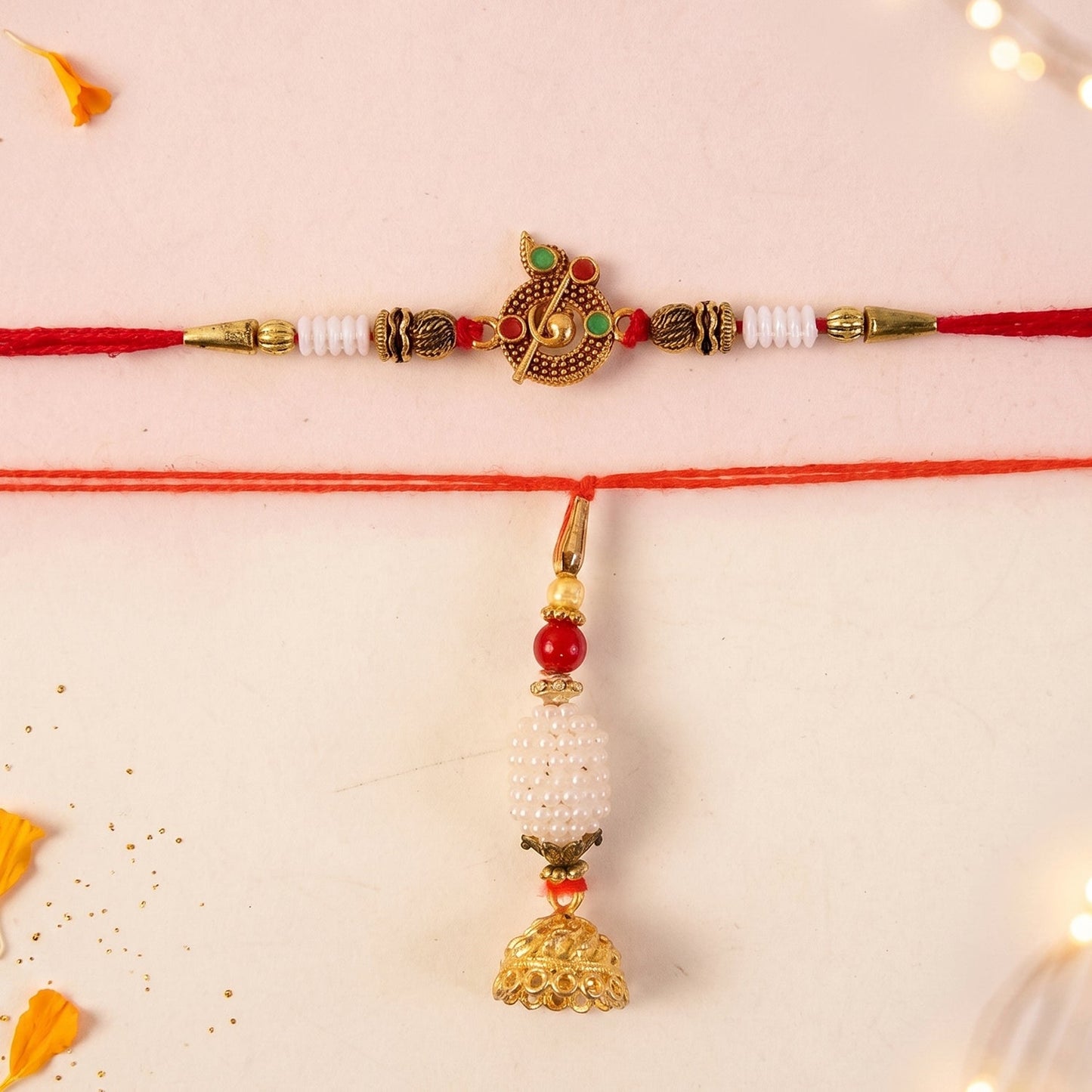 Pearl Peacock Bhabhi Rakhi with golden tassel on white background
