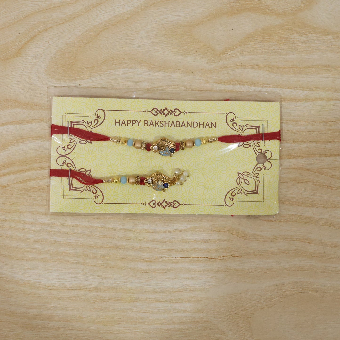 Pearl Bead Bhabhi Rakhi angled close-up with latkan colors
