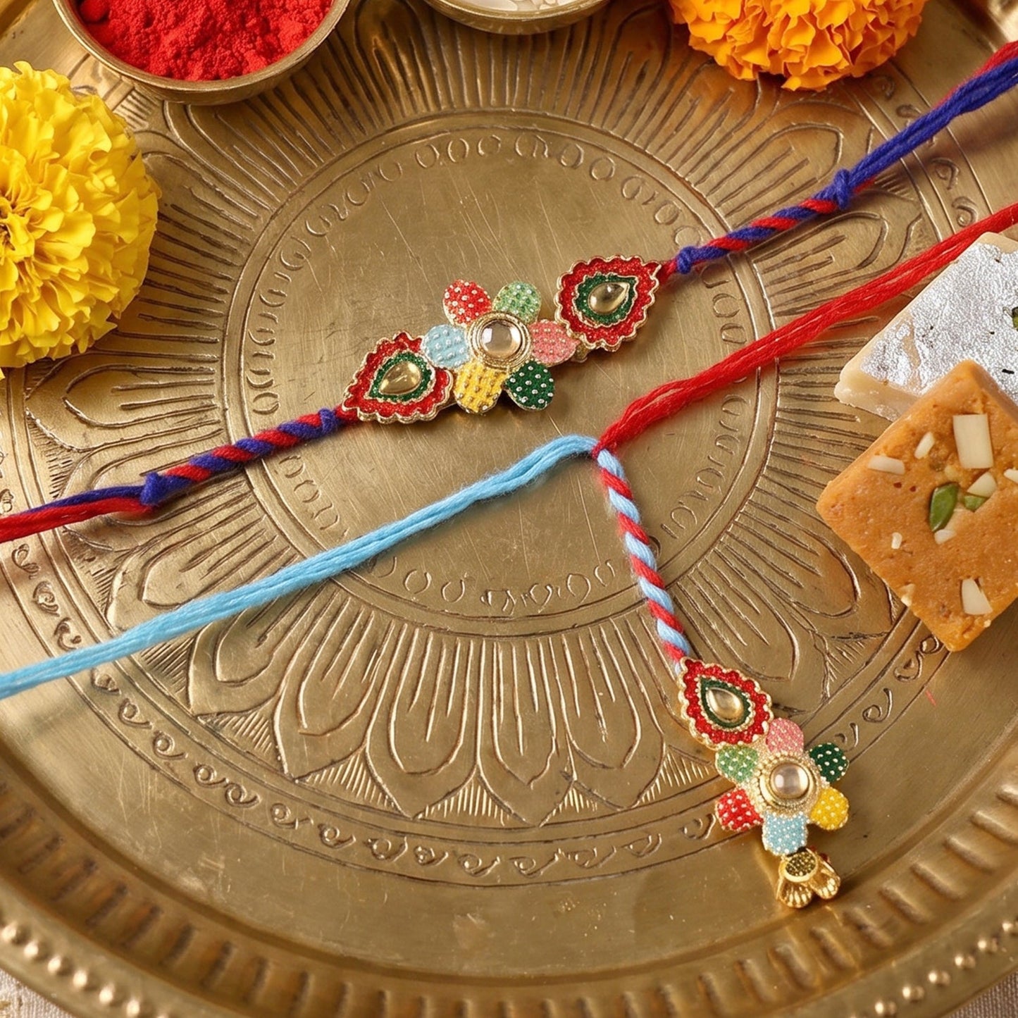 Side angle of multicolor thread Bhabhi Rakhi with floral latkan detail