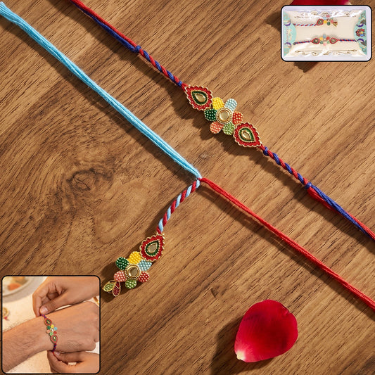 Multicolor Meenakari Bhabhi Rakhi with vibrant blue thread close-up